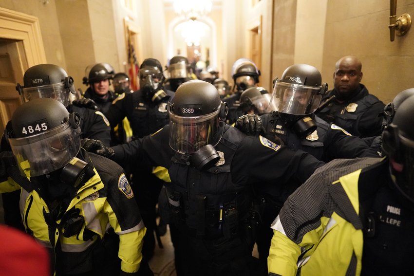 Riot police clear the hallway inside the Capitol on Wednesday, Jan. 6, 2021 in Washington, D.C. A New Jersey man with alleged ties to Nazism was convicted for his actions during the Jan. 6 attack on the U.S. Capitol after claiming he was unaware that Congress meets under that big dome. (Kent Nishimura/Los Angeles Times/TNS)