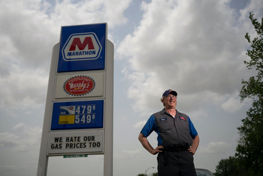 Murphy&rsquo;s Service Center owner Chuck Graff with the sign he put up at his St. Anthony gas station. Profit margins are very narrow for gas station owners, even as prices rise. (Jeff Wheeler/Minneapolis Star Tribune/TNS)