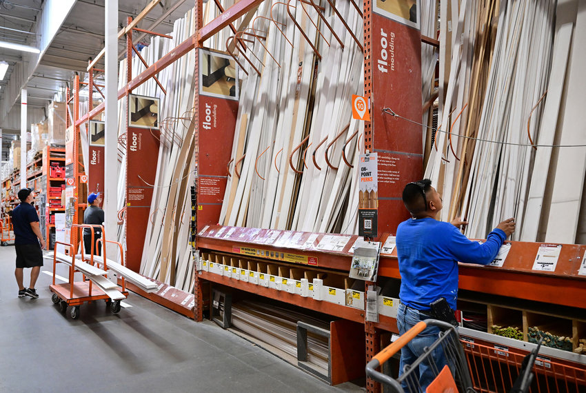 People shop for flooring at a home improvement store on Aug. 16, 2022, in Alhambra, California.