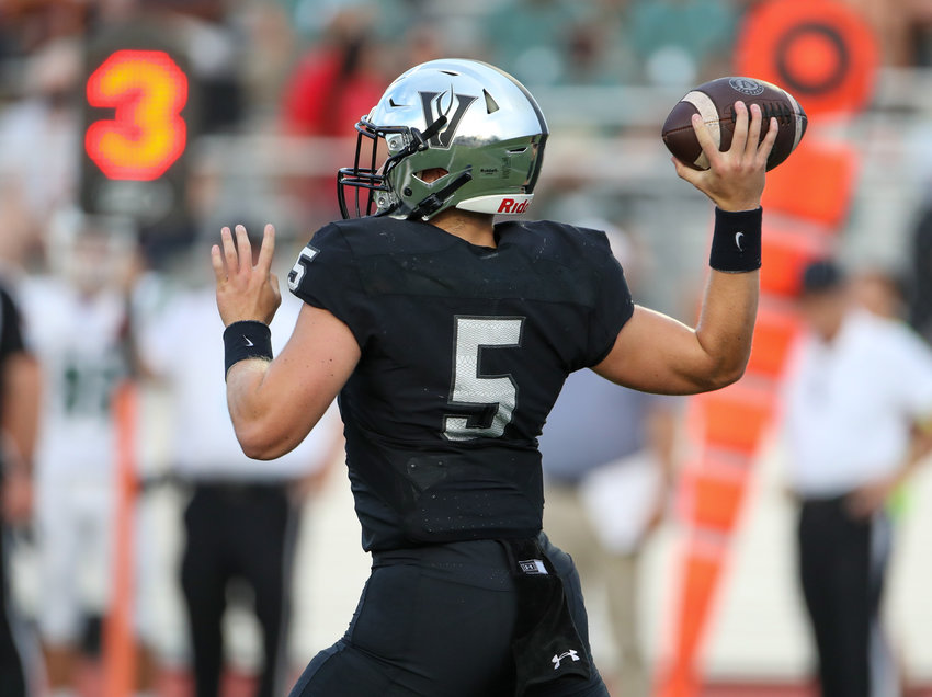 Vandegrift Vipers junior quarterback Brayden Buchanan (5) drops back to pass during a high school football game on August 27, 2021 in Austin, Texas.