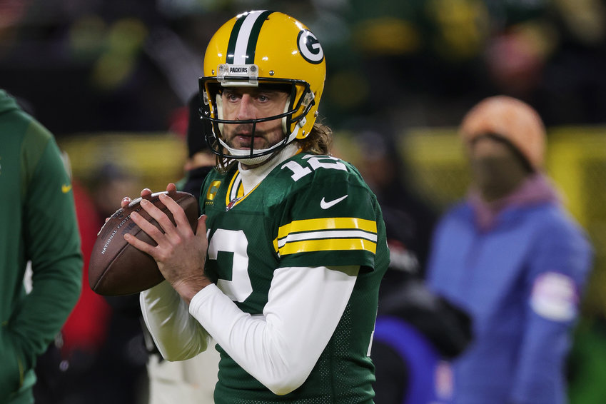 Aaron Rodgers (12) of the Green Bay Packers warms up before playing the San Francisco 49ers in the NFC Divisional Playoff game at Lambeau Field on Jan. 22, 2022, in Green Bay, Wisconsin. (Stacy Revere/Getty Images/TNS)