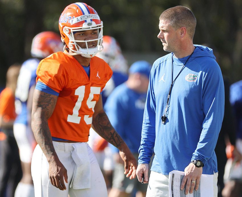 Florida quarterback Anthony Richardson (15) with head coach Billy Napier at the Sanders Football Practice Field on the UF campus in Gainesville, Florida, on March 17, 2022. (Stephen M. Dowell/Orlando Sentinel/TNS)
