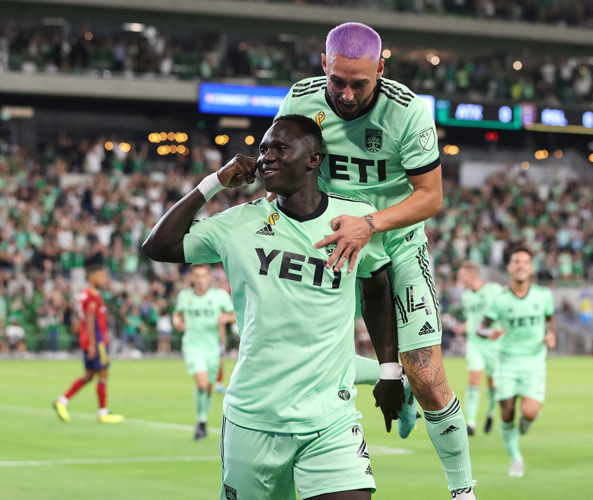 Austin FC forward Moussa Djitt&eacute; (2) gestures to the supporters as forward Diego Fag&uacute;ndez (14) comes over to celebrate after a goal during a Major League Soccer match against Real Salt Lake on September 14, 2022 in Austin, Texas. Austin FC won 3-0.