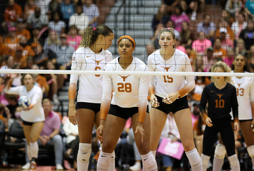 Texas middle blocker KAYLA CAFFEY (28) awaits the start of play on a Longhorns serve during an NCAA college volleyball game between Texas and West Virginia on Oct. 22, 2022, in Austin. Texas won 3-0.