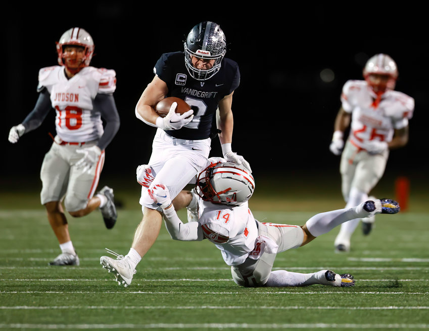 Vandegrift senior running back Alex Witt (0) carries the ball through the tackle attempt of Judson defensive back Jeffrey Bondoc (14) during a high school football playoff game on Nov. 18, 2022 in Austin.