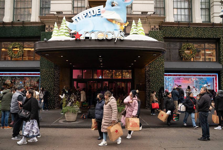Black Friday shoppers walk in Manhattan's Herald Square in New York on Nov. 25, 2022.