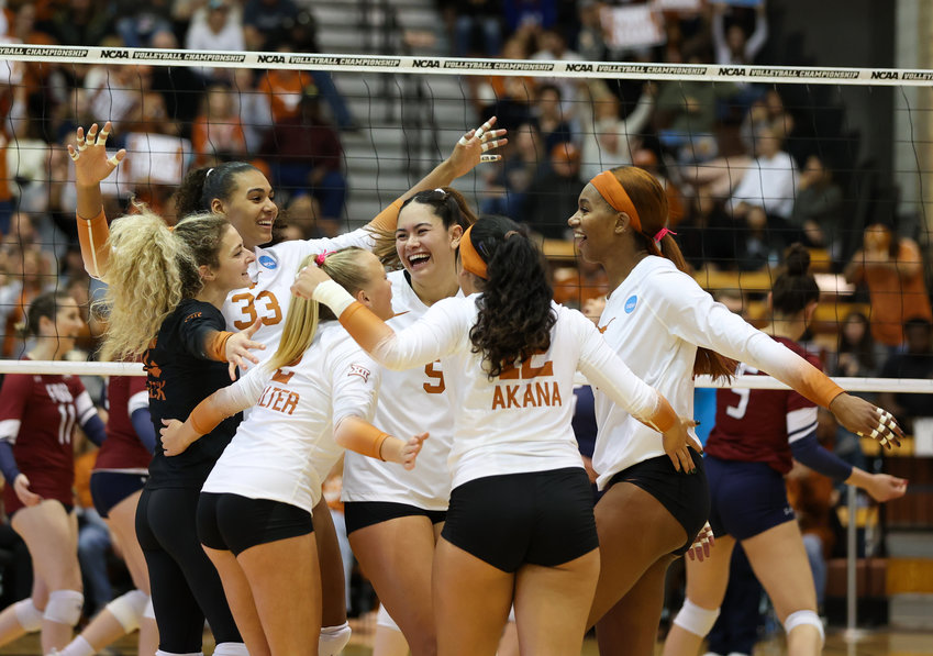The Texas Longhorns celebrate a point during a first-round match between Texas and Fairleigh Dickinson in the NCAA volleyball tournament on Dec. 1, 2022 in Austin, Texas. Texas won, 3-0.