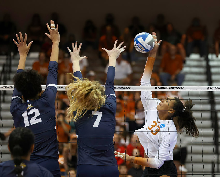 Texas outside hitter LOGAN EGGLESTON (33) at the net during an NCAA volleyball tournament regional semifinal match between Texas and Marquette on Dec. 8, 2022 in Austin, Texas.
