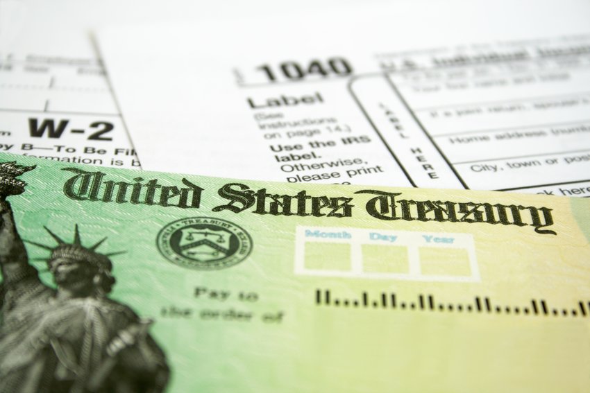 Tax Refund Check with W-2 and 1040 U.S. Individual Income Tax Return Forms (Getty Images/TNS)