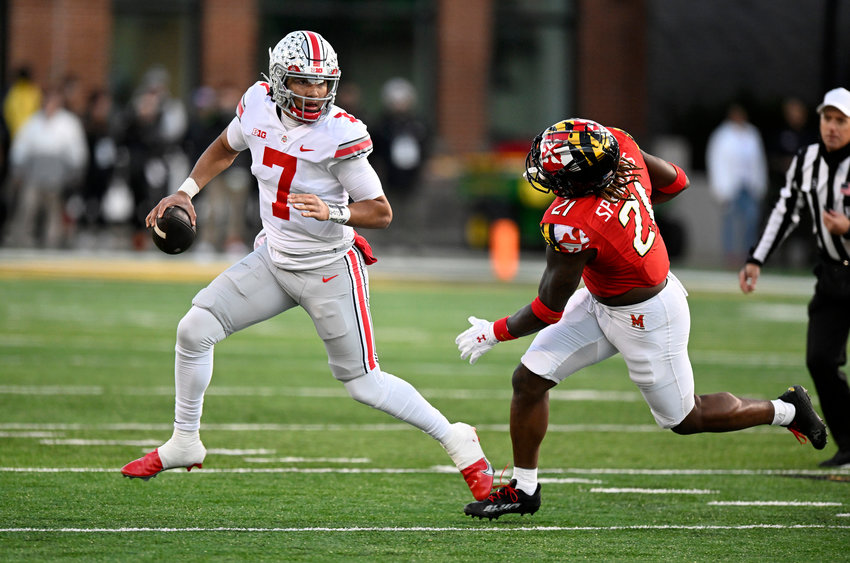 C.J. Stroud (7) of the Ohio State Buckeyes rolls out of the pocket against Gereme Spraggins (21) of the Maryland Terrapins in the second quarter at SECU Stadium on Nov. 19, 2022, in College Park, Maryland. (Greg Fiume/Getty Images/TNS)