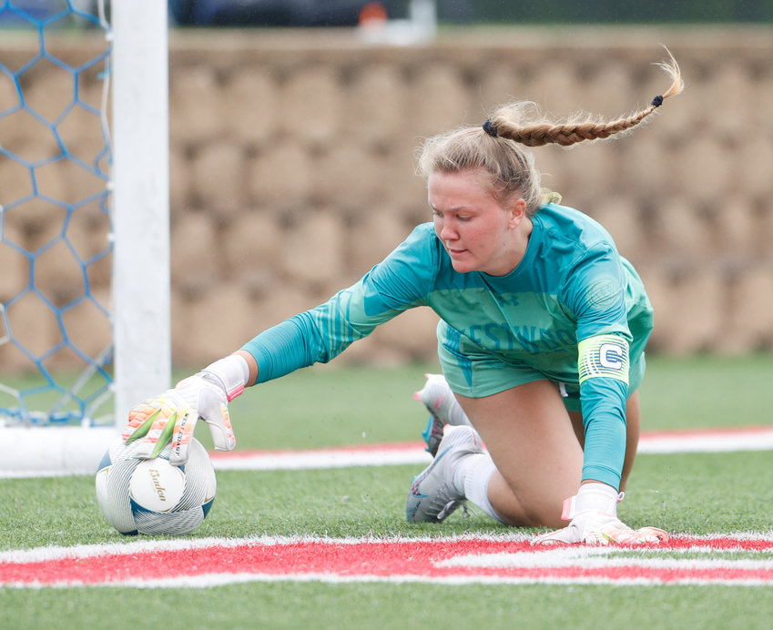 Westwood goalkeeper Atlee Olofson (99) reaches to grab the ball for a save during the Class 6A girls state semifinal soccer game between Marcus and Westwood on April 14, 2023 in Georgetown.