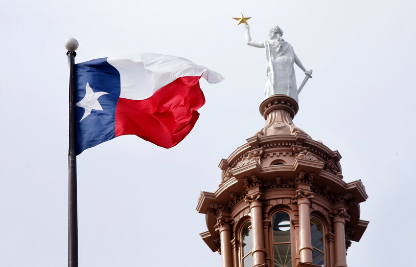 The Texas flag flies over the Texas Capitol in Austin, Texas, Wednesday, May 22, 2019.