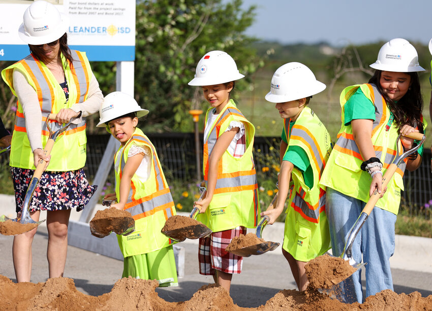 Students from Jim Plain and Bagdad elementary schools help with a Leander ISD groundbreaking ceremony for Elementary School No. 30, in Leander on April 28, 2023.