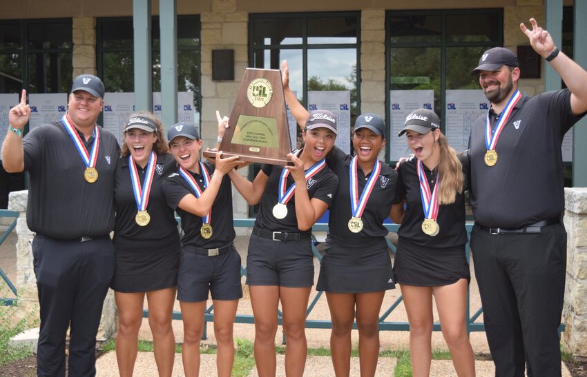 The Vandegrift girls golf team lifts the trophy after winning the state title on Tuesday. From left to right: Head caoch Aaron Ford, Eden McSpadden, Mimi Burton, Breanna Hoese, Danica Lundgren, Sydney Givens, coach Jaime Sierra.