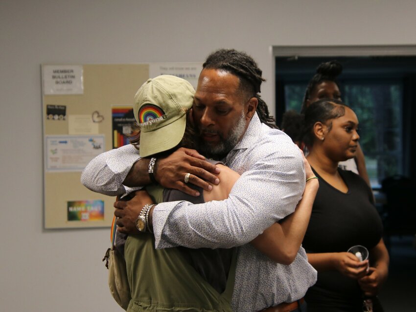 Anthony Hill, the father of slain 24-year-old gay woman Akira Ross, hugs an attendee Sunday, July 2, 2023, at a memorial held for Ross at Live Oak Unitarian Universalist Church in Cedar Park.