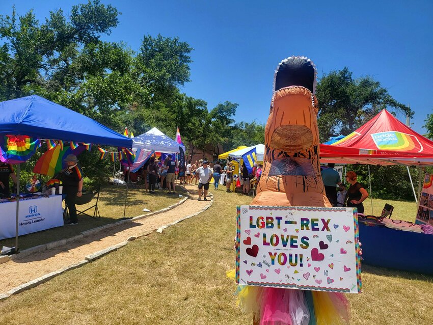 An attendee dressed as the &quot;LGBT-Rex&quot; parades Saturday, July 15, 2023, through the Queer EmPower Pride Conference &amp; Festival jointly hosted by Cedar Park and Leander Pride at Live Oak Unitarian Universalist Church in Cedar Park.