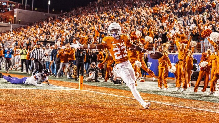 Texas Longhorns defensive back Jahdae Barron gestures after scoring a touchdown during the 2022 football season.