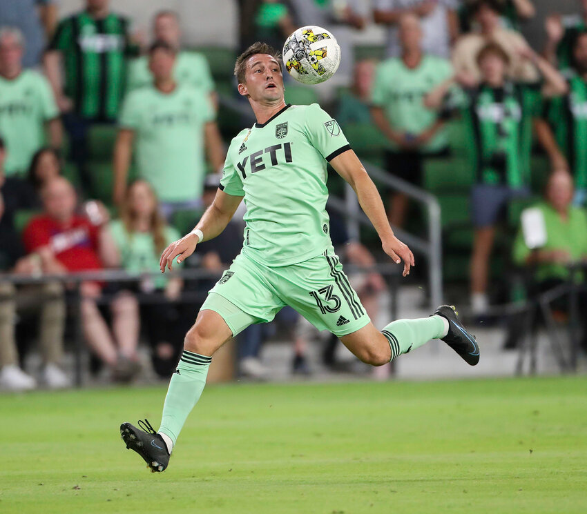 Austin FC midfielder Ethan Finlay (13) works to get possession of the ball during a Major League Soccer match against Real Salt Lake on September 14, 2022.