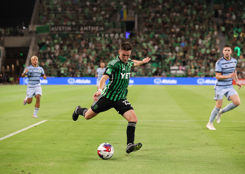 Austin FC midfielder Ethan Finlay (13) lines up a shot on goal during in Saturday's MLS match against Sporting Kansas City. Finlay scored a 19th minute goal and was named to the Team of the Matchday for his performance.