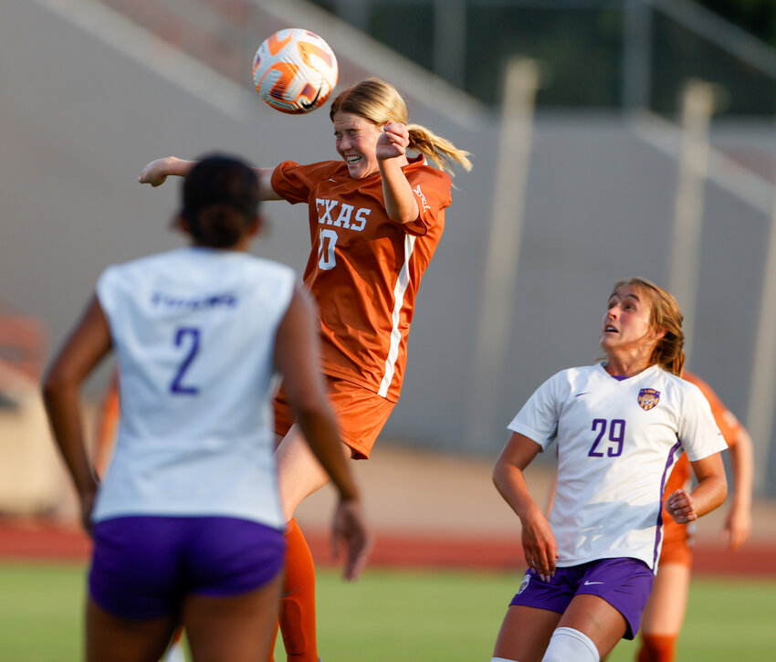 Texas midfielder Lexi Missimo (10) heads the ball during an NCAA women&rsquo;s soccer match between Texas and LSU on August 24, 2023 in Austin. LSU won, 3-1.