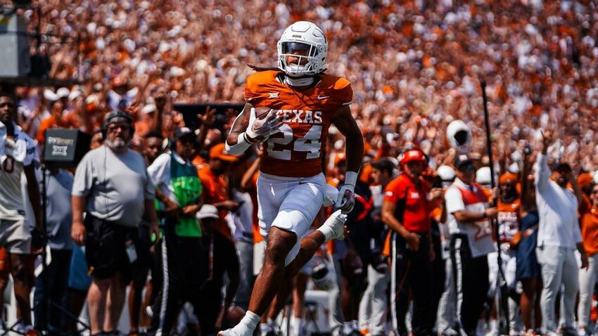 Texas running back Jonathan Brooks (24) carries the ball on a 37-yard touchdown reception in Saturday's home opener against Rice.