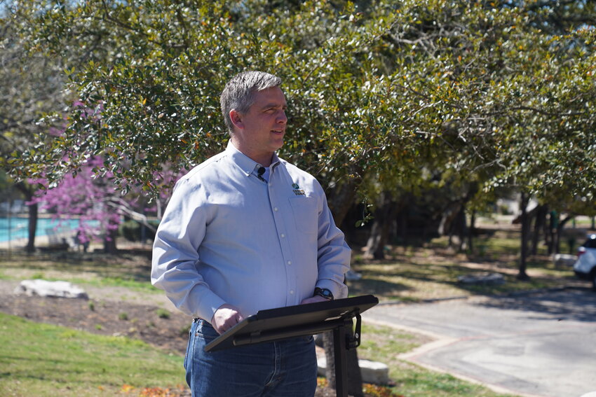 Cedar Park Mayor Jim Penniman-Morin speaks at the ribbon cutting for the Anderson Mill Road Phase 2 construction project on March 5.