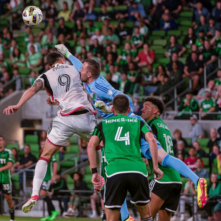 Austin FC goalkeeper Brad Stuver (1) punches a ball away to make a save in last Saturday's 2-1 win over FC Dallas. Through six matches this season, Stuver has faced a league-high 38 shots on target and is second in total number of saves and fourth in MLS in save percentage (81.6%).
