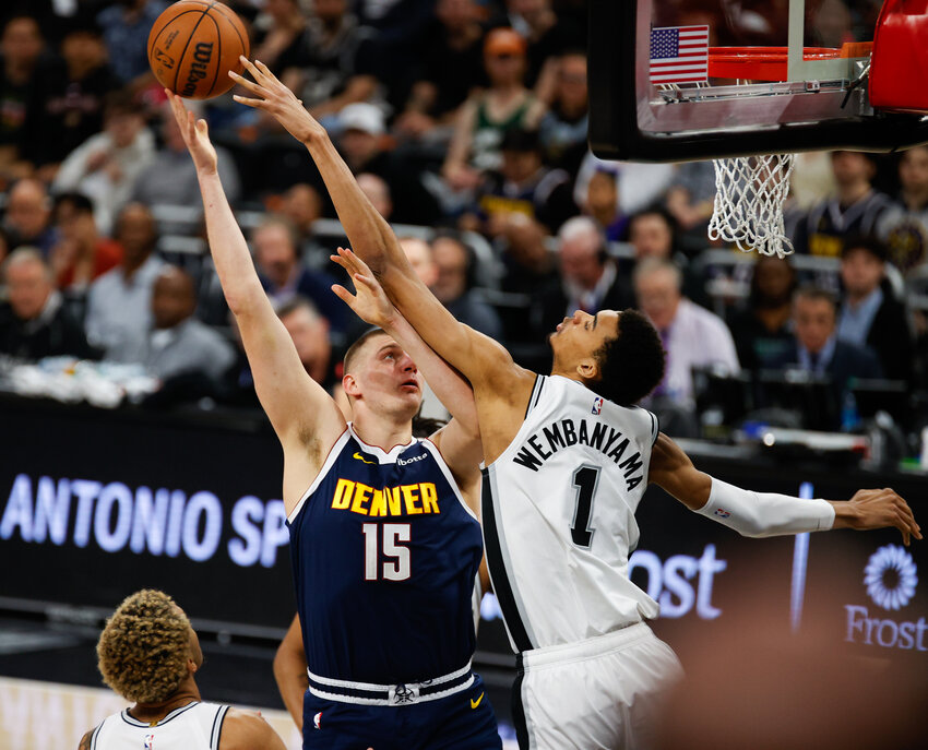 Nuggets center Nikola Jokic shoots the ball over Spurs center Victor Wembanyama in last Friday's game at the Moody Center, where Denver beat San Antonio 117-106.