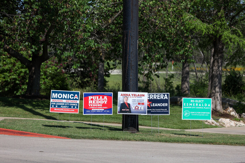 Campaign signs can be seen across the area as early voting kicked off on Monday for the May 4 election.