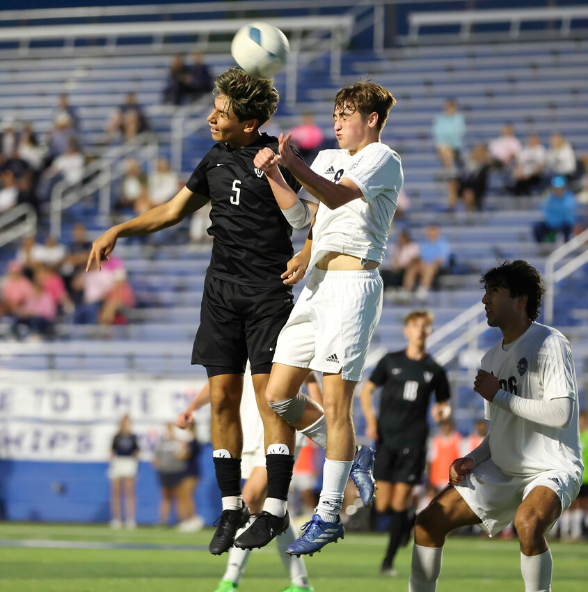Vandegrift midfielder Emmy Aranda (5) and Flower Mound defender Carter Simpson (8) leap to head the ball during the Class 6A boys state soccer semifinal between Vandegrift and Flower Mound on April 12, 2024 in Georgetown. Flower Mound won 2-0.
