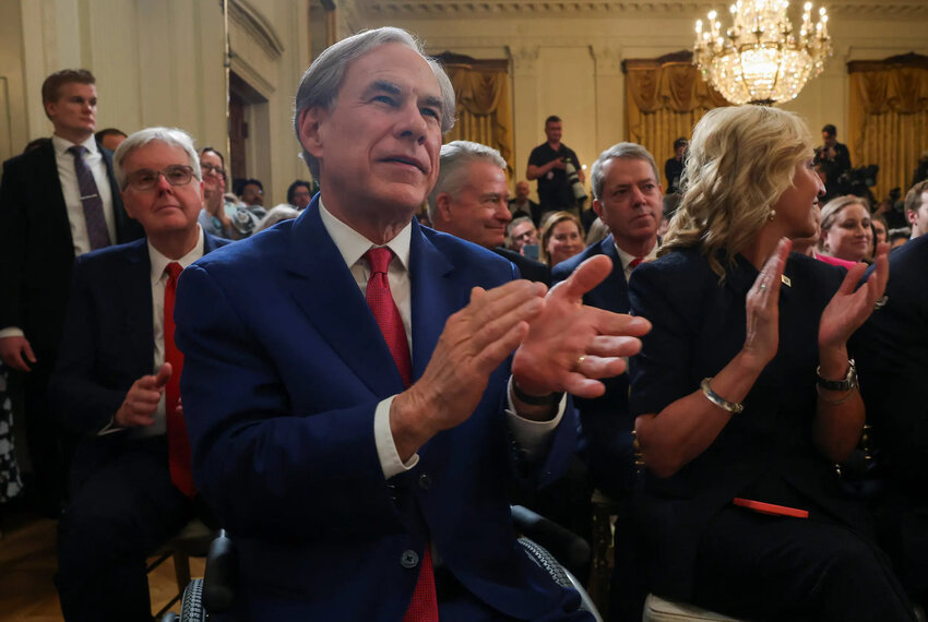 Gov. Greg Abbott applauds as he attends the signing of an executive order to shut down the Department of Education by President Donald Trump at the White House in Washington, D.C., on March 20, 2025.