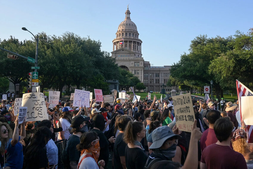 Demonstrators march in front of the Capitol in Austin during a protest against ICE on Monday, June 9, 2025.