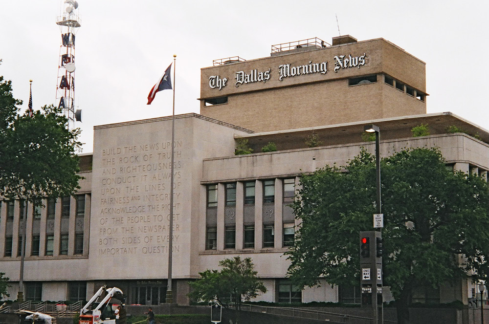The &ldquo;Rock of Truth&rdquo; towers three stories on the Dallas Morning News offices.