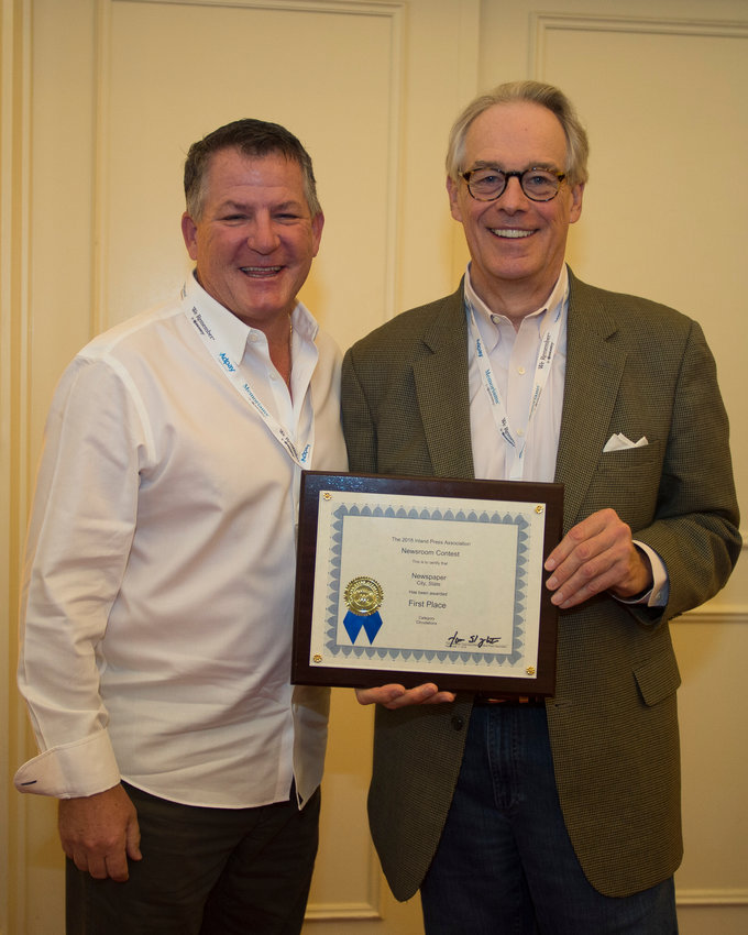 The Villages (Florida) Daily Sun Associate Publisher James Sprung (right), accepts Best in Show award from Inland Executive   Director Tom Slaughter.