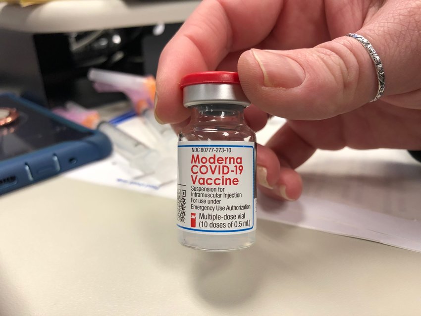 A vial of the Moderna COVID-19 vaccine with at least one dose remaining.