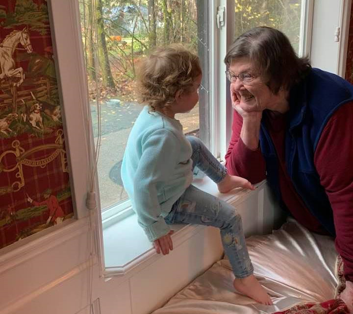 Columnist Kathleen Anderson enjoys a moment with one of her eight great-granddaughters, Prairie Thomas, at home in Olympia in December 2020.