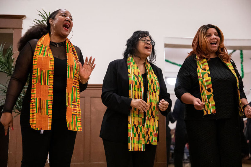 NAAM’s African American Cultural Ensemble sings during the Kwanzaa celebration at Washington Hall on Thursday, Dec. 29, 2022. (Amanda Snyder/Crosscut)
