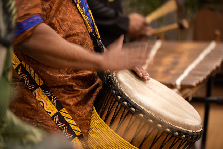 Musicians from ADEFUA Cultural Education Workshop, which teaches African drumming and dancing, perform at Northwest African American Museum’s Kwanzaa celebration at Washington Hall on Thursday, Dec. 29, 2022. (Amanda Snyder/Crosscut)