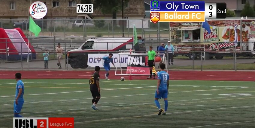 Trevor Thompson delivers a corner for Oly Town FC as they tried to battle back from three goals down.