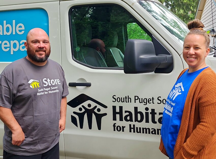 Staff members Zac Marti and Amber Markland with the Habitat for Humanity Truck. June 2023.