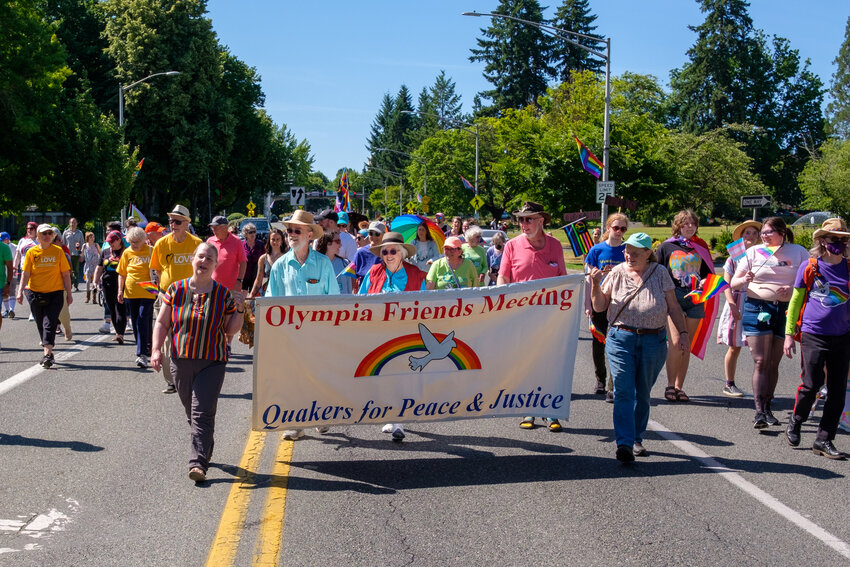 Members and friends of Olympia Friends Meeting carried this banner in the Pride March on July 1, 2023.