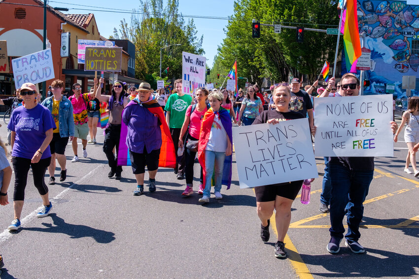 Some of the Pride Day marchers carried signs, such as those that read, "Trans Hotties," "We are all Human," "Trans Lives Matter" and "None of us are Free Until All of Us are Free" on Saturday, July 1, 2023.
