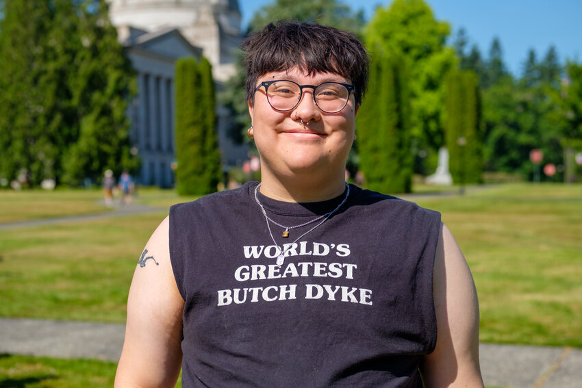 This woman's shirt proudly proclaims her as the "World's Greatest Butch Dyke" at the Pride Parade on July 1, 2023.