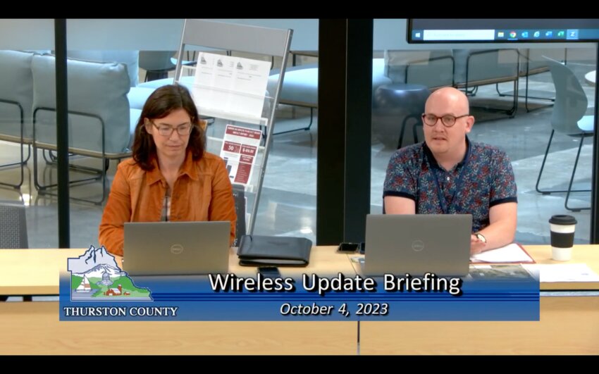 Associate Planner Andrew Boughan (right) discussed the Wireless Code updates.