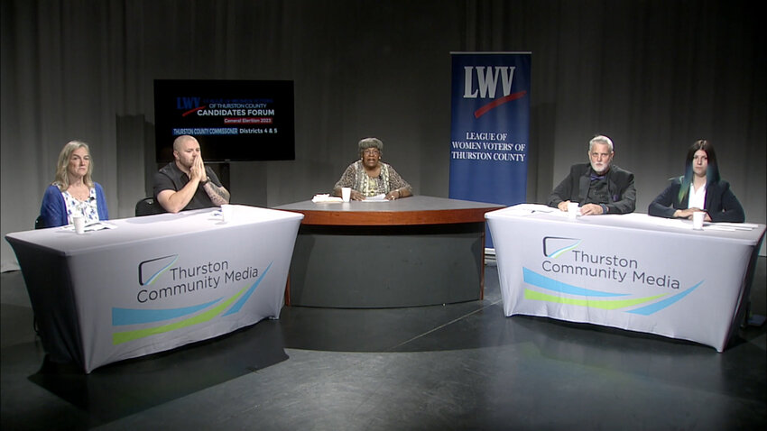 This image shows the Candidates Forum for the two new seats on the Thurston County Commission.  Shown, l-r are District 4 candidates Vivian Eason and Wayne Fournier, Moderator Thelma Jackson, and District 5 candidates Terry S. Ballard and Emily Clouse. The full-length video of this forum is available in two clicks from this story.