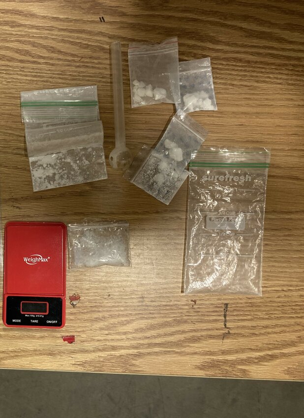 Suspected narcotics and digital scale found inside the suspect’s car.