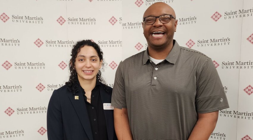Career Development Manager Nuvia Rodriguez (left) works with students in Cybersecurity Administration to help them plan their careers and apply for jobs. Here, she poses with Ernest Jackson (U.S. Army) of Yelm, WA, who has accepted a position with Lockheed Martin.