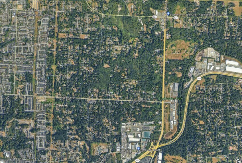 Aerial map of part of Bothell’s Urban Growth Area, showing a distinct division between urbanized land inside the UGA and forested land outside the UGA.