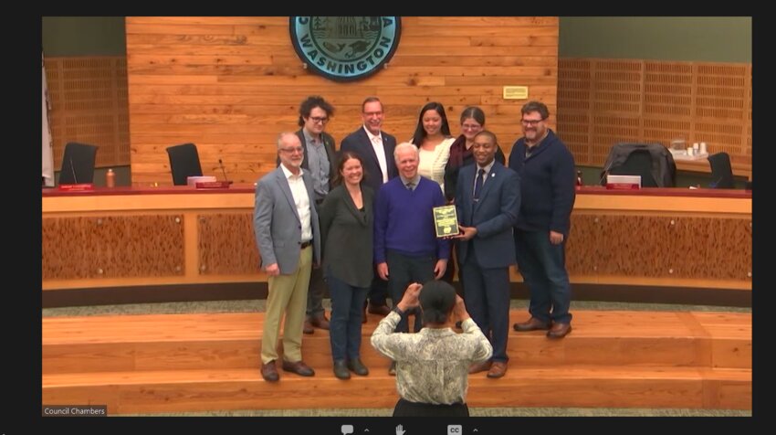 Olympia City councilmembers and City Manager Jay Burney posing with Greg Griffith, Olympia Historical Society board president, after presenting the Gerry L. Alexander Outstanding Achievement in Heritage award.