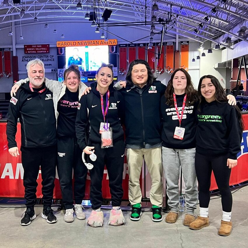 The historic delegation representing Evergreen State College in the 2024 NAIA Women’s Wrestling National Championship. (From L-R: Assistant Coach John Lane, Ellabelle Taylor, Flor “Jasmine” Parker-Borreo, Head Coach Fan Zhang, Erica Grant, Nizhoni Tallman).